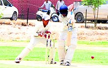 A batsman plays a shot during the match at Police Public School grounds