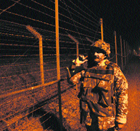 A soldier patrols along the Line of Control in Jammu.
