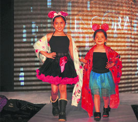 Children sashay down the ramp during a fashion show at the buyer-seller meet of the knitwear industry in Ludhiana. Tribune 