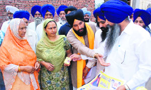 SAD candidates seek votes at a village near Rajpura on Wednesday. 
