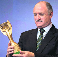 Scolari wth a replica of the World Cup trophy Brazil won in 1970. 