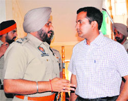 SSP Ravcharan Brar and DC KK Yadav discuss a point on Thursday. The district administration is gearing up to hold the zila parishad and panchayat samiti elections.
