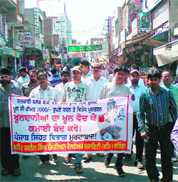 Members of the Bathinda Association of Non-Governmental Organizations (BANGO) stage a protest in the city on Thursday against the hike in the price of blood units.