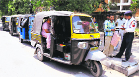 A policeman challans an autorickshaw driver on the road dividing Sectors 22 and 23 in Chandigarh on Thursday.