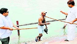 Members of the Bhagirathi Sewa Samiti request people not to wash clothes in the Ganga at the Alaknanda ghat in Haridwar on Thursday