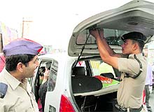 Regional transport officials along with the police remove dark films from windowpanes of cars in Dehradun on Thursday