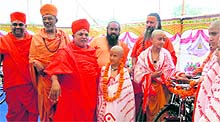 Jagadguru Raj Rajeshwaranand Maharaj and Maha Mandaleshwar Kamlanand Maharaj distribute cycles to students as part of the 21st annual function of Swami Narayan Ashram in Haridwar