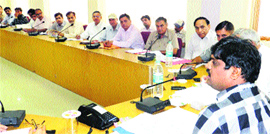 Jhajjar DC Ajit Balaji Joshi during a meeting of district officials at Jhajjar.