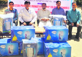 State Bank of India officials at Government High School, Nomai in Katra on Thursday.