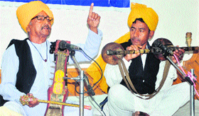 Artistes perform during a folk and traditional music programme, organised by the J&K Academy of Art, Culture and Language, in Jammu on Thursday.