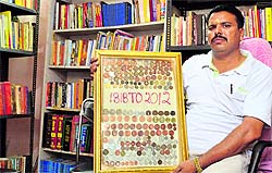 Arun Sidhu of Bhagwan Valmiki Library shows a collection of coins during an exhibition in Ludhiana on Thursday