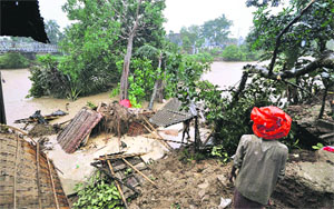 A tree fell on a house after heavy rain in Agartala on Thursday. 