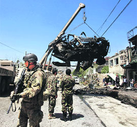 Security personnel at the site of a suicide attack in Kabul on Thursday. 