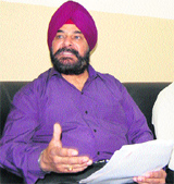 JS Sodhi, Passport Officer, addresses mediapersons in Amritsar on Friday.