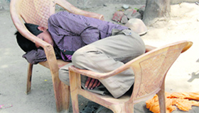 A labourer takes a nap at a construction site on the Bibiwala road in Bathinda.