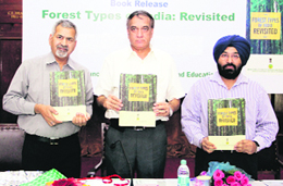 Deputy Director General (Research), ICFRE, PP Bhojvaid, Director General VK Bahuguna and Additional Director General TP Singh at a book releasing ceremony in Dehradun on Friday. 