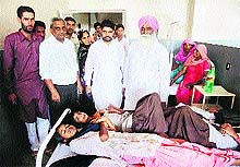 Ratia MLA Jarnail Singh inquires about the health of schoolchildren who were taken ill after consuming iron tablets at Ratia in Fatehabad on Friday