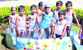 Students of Kids Paradise School enjoy a pool party in Jalandhar on Friday.
