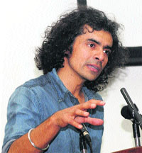 Bollywood director Imtiaz Ali addresses students at the University of Kashmir on Friday.