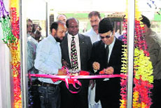 Finance Minister AR Rather inaugurates a modernised post office at Chadoora on Friday. 