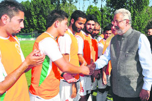 Minister for Medical Education, Youth Services and Sports Taj Mohi-ud-din interacts with sportspersons at the inauguration of Kashmir Football Festival-2013 on Friday. 