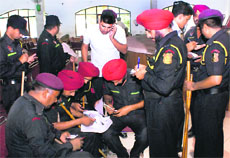  Police personnel in Rajpura go through their duty chart, for the May 19 panchayati raj elections in the state, on Friday.