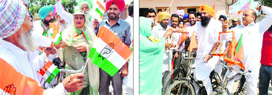 Candidates distribute party flags while campaigning on bicycles in Patiala villages on Friday.