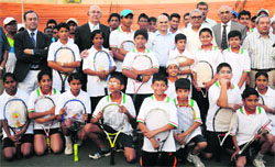 Trainees with the CLTA officials and members of the Madrid Tennis Foundation in Chandigarh on Saturday. 
