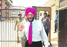 Milkha Singh comes out of the District Courts in Chandigarh on Saturday. 