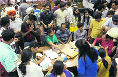 Law graduates deposit their fees for the convocation during the rehearsal at the PU on Saturday.