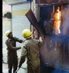 Firefighters try to douse the fire that broke out in a toy factory in the Inderlok area, west Delhi, on Saturday.