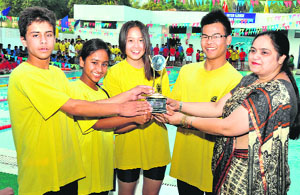 The winners of the Inter-House Swimming Competition in Dehradun on Saturday.