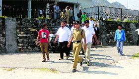 Congress legislator Harish Dhami (second from left) comes out of the Didihat court following rekection of his bail application on Saturday.