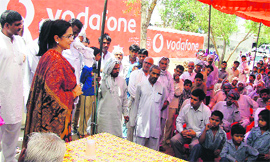 Haryana minister Kiran Choudhry addresses villagers at Bigowa in Bhiwani on Saturday.