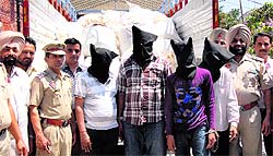 The four accused, arrested with a truck loaded with poppy husk, in police net in Jalandhar on Saturday