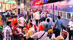 Passengers wait for their trains at the railway station in Jalandhar on Saturday
