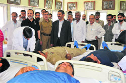 Volunteers donate blood during a camp at Sher-e-Kashmir Institute of Medical Sciences , Soura, on Saturday.