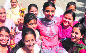 Mehak, who topped in the state in the arts stream, in jubilant mood in Ludhiana. 