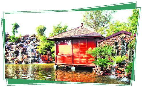 A huge waterfall near the water bungalows offers a soothing view