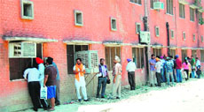 Visitors to the District Transport Office have to stand outside in the open in scorching heat to get their work done in Amritsar. 