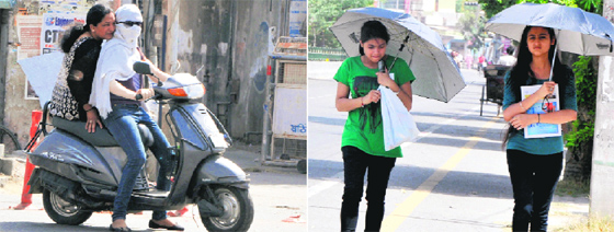With summer finally setting in its full splendour, it is only natural for people in the city to find ways to protect themselves from the searing heat. A girl covers her face (left) while going out on a scooty while umbrellas come to the rescue of others who have to venture out in the sun. With rains still distant on the horizon, the heat is literally on in Bathinda and its adjoining areas.