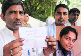 Victim Pardeeps (inset) father shows the suicide note at Government Multi-Specialty Hospital in Sector 16, Chandigarh, on Sunday. 