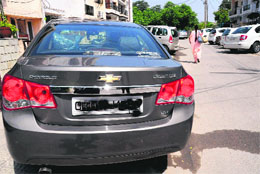 A car with a defaced number plate at Sector 32, Chandigarh, on Sunday