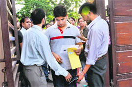 A candidate being frisked at an examination centre in Chandigarh on Sunday 
