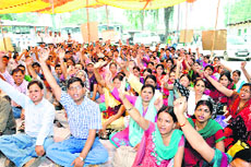 BTC teachers hold a demonstration in support fo their demands in Dehradun on Sunday.