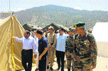 The Commander Sector, Rashtriya Rifles (RR), Suigarh, alongwith Doda DC Mubarak Singh inspects the relief work on at Doda, on Sunday. 