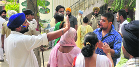 Supporters of rival candidates exchange heated arguments at Sohana village in Mohali on Sunday. 