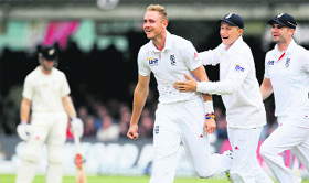 England's Stuart Broad celebrates the wicket of Ross Taylor in their first Test match at Lord's in London Sunday.