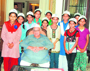Governor Aziz Qureshi with children who participated in a camp organised by the Uttarakhand Bal Kalyan Parishad in Dehradun on Monday.
