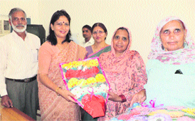 Village women welcome the Vice-Chancellor, Dr Pankaj Mittal, on the opening of the one-day workshop on the premises of Women University, Khanpur Kalan.